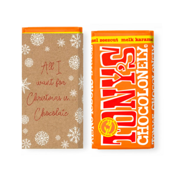 Kerstkaart met sneeuwvlokken en chocolade op kraft