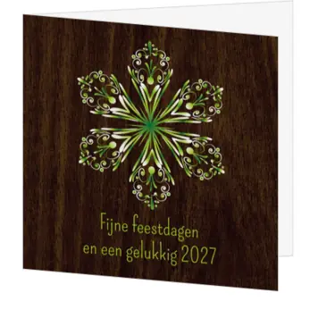 kerstkaart met groene sneeuwvlok op hout
