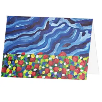 Kerstkaart met schilderachtig bloemenveld en blauwe lucht